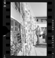 Harold M. S. Richards of "Voice of Prophecy" radio broadcasts viewing wall of birthday cards in Glendale, Calif., 1973