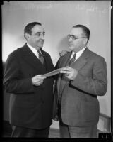 Captain of Detectives E. Raymond Cato receives first pension check from Irving H. Hellman, Los Angeles, 1935