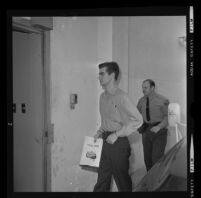 Bobby Augusta Davis being escorted to his murder trial by a deputy sheriff, Van Nuys, 1970