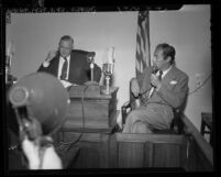 Actor Rex Harrison answering questions from coroner Ira Nance at inquiry on Carol Landis' suicide, Calif., 1948