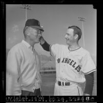 Pitcher Aubrey Gatewood and football player Don Hutson at Angels' training camp in Palm Springs, Calif., 1964