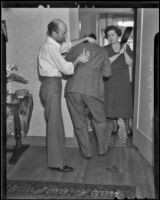 D. A. and Helen Williams reenact robbery at neighbor's home, Los Angeles, 1936