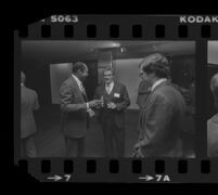 Tom Bradley (left) talks with Otis Chandler during reception for Freedom of Press exhibit, 1980