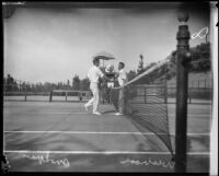 Harvey Snodgrass and Walter Wesbrook shaking hands on tennis court, Midwick Country Club, Alhambra, 1925