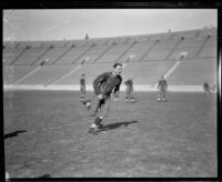 Football player Earl Britton running, Los Angeles Coliseum, Los Angeles, 1926