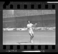 Actor-singer Ricky Nelson playing in the 30th annual Motion Picture Tennis Association Tournament in Encino, Calif., 1964