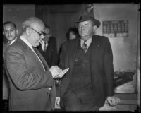 Eugene Kent, President of Glendale Protective Association, speaking with a reporter, Glendale, 1935