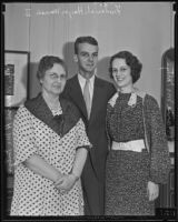 Gertrude McIntyre, wife of President Roosevelt's Secretary, with her daughter Marie McIntyre and her fiance Frederick Hayes Warren II, Los Angeles, 1935