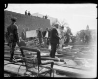 View of the wreckage from a collapsed grandstand on the route of the Tournament of Roses parade, Pasadena, 1926