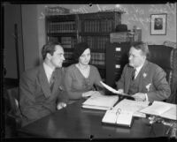 Actor Fredric March, Mrs. Carol Gallagher, and Judge Lewis H. Smith discussing bond to release property of actress Mary Astor, 1932