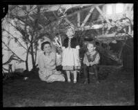 Jewell Lorraine Newcomb and Jimmy Strand with designer Georgia Chobe on the "Hansel and Gretel" Tournament of Roses float, Pasadena, 1933