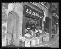 Japanese American grocer at K. M. Akiyama Co. in Little Tokyo, Los Angeles, Calif., 1937