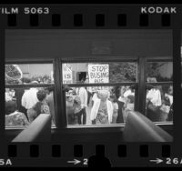 View from bus window looking out at parents picketing against school busing in San Pedro, Calif., 1980