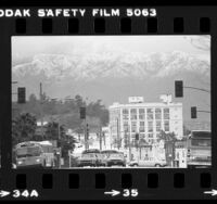 Snow covered Mt. Wilson viewed from Spring Street in downtown Los Angeles, Calif., 1980