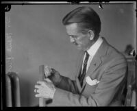 S. Maus Purple, measuring a fossilized shark tooth that he found, Los Angeles, 1924