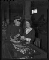 Police Chief Guy C. Welch and merchant M. Osburn, Whittier, 1936