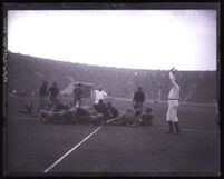 U.S.C. vs. Washington, players piled up at the goal line as referee signals touchdown, Los Angeles, 1927