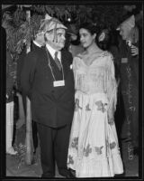 Isidore B. Dockweiler and Adriana Figueroa celebrating the city's one hundred and fifty-fourth anniversary at Olvera Street, Los Angeles, 1935