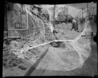 Commercial street with brick rubble on the ground after the Long Beach earthquake, Southern California, 1933