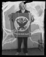 Thomas Watson holding a flag for the NRA, circa 1933