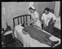 Doris Dick is treated by Nurses Alta May Stuart and William Partin, Los Angeles, 1936