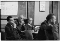 Alexander Pantages sitting at table with other men during his rape trial, Los Angeles, 1929