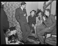 Richard Ritchie, Alma Lloyd, Paula Stone, and Ronald Howard at a cocktail party, Los Angeles, 1936