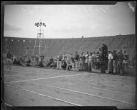 Charley Paddock crossing finish line at Los Angeles Memorial Coliseum, Los Angeles, 1928