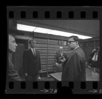 Jack Kirschke in a law office with four men, Los Angeles, 1967