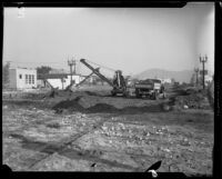 Crane on Honolulu Avenue clearing debris left by a catastrophic flood and mudslide, La Crescenta-Montrose, 1934