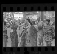 International Society for Krishna Consciousness members dancing and chanting on Broadway Street in Los Angeles, Calif., 1970