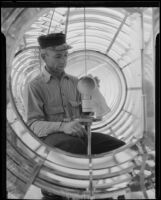 Point Vicente Lighthouse first assistant keeper Thomas A. Atkinson polishing light, Rancho Palos Verdes, 1935