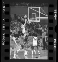 UCLA basketball player Bill Walton playing against Louisville Cardinals in NCAA semifinals, 1972