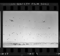 U.S. paratroopers of the 82nd Airborne Division filling the sky over Camp Roberts, Calif., 1984