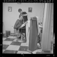 Businessman Sol Biharie getting his hair styled by Darrell Wilde in Los Angeles, Calif., 1964