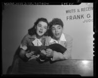 Child actors Anna Maria Alberghetti and Chet Allen in court waiting for contract approvals in Los Angeles, Calif., 1952