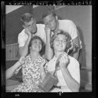 Taft High School's boy's and girl's swim team members with first girl's trophy in Los Angeles, Calif., 1961