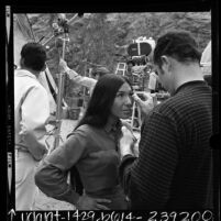 Native American singer Buffy Sainte-Marie with make-up artist on set of "The Virginian", 1968