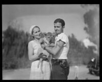 Lion Cub and zookeepers at the California Zoological Gardens, Los Angeles, 1935