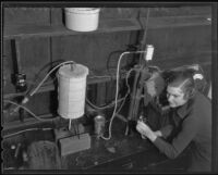 Frances Dunlop conducts a science experiment, Los Angeles, 1935