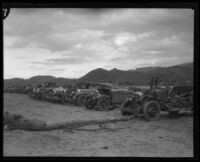Row of automobiles damaged by the flood that followed the failure of the Saint Francis Dam, Santa Clara River Valley (Calif.), 1928