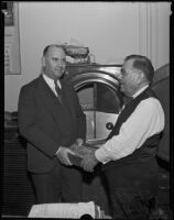 H. L. Byram and Herbert D. Alfonso place money in a vault, Los Angeles, 1935