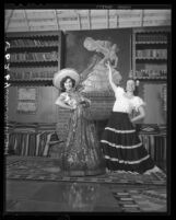 Mrs. S. A. Guiberson and Aurora Magallon wear costumes for Fiesta Pan-Americana in Santa Monica, Calif., 1949