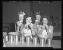 Women shown testing pears they are canning at Puente Canning Center, Calif., 1946