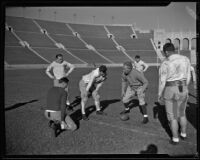 Coach Howard Jones instructing his team at the Los Angeles Memorial Coliseum. Los Angeles, 1925-1939