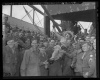 Pin-up girl Marjorie Main, western actress being hoisted on the soldiers of the 96th Division Deadeye troops, 1946