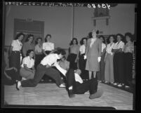 Agnes S. Albro, newly appointed police commissioner, inspects policewomen training in Los Angeles, Calif., 1946