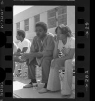 Male and female prisoners in yard of Federal Correctional Institution at Terminal Island, Calif., 1977