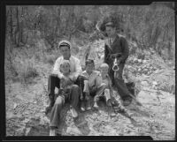 Battalion Chief Ward and Fireman Booth with the rescued Clarence Ward, Robert Jeanette and Robert Ellis, Arroyo Seco, 1935