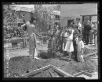 Actress Anna May Wong and children at tree planting ceremony in Los Angeles, Calif., 1938